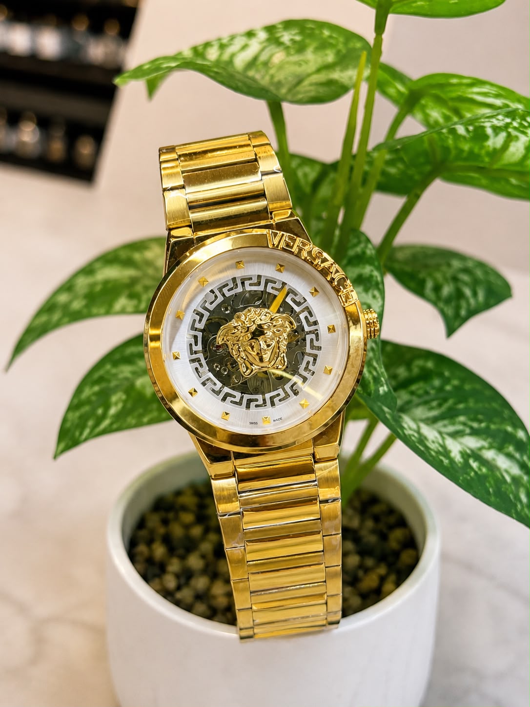 Versace (logo and bezel engraving visible)