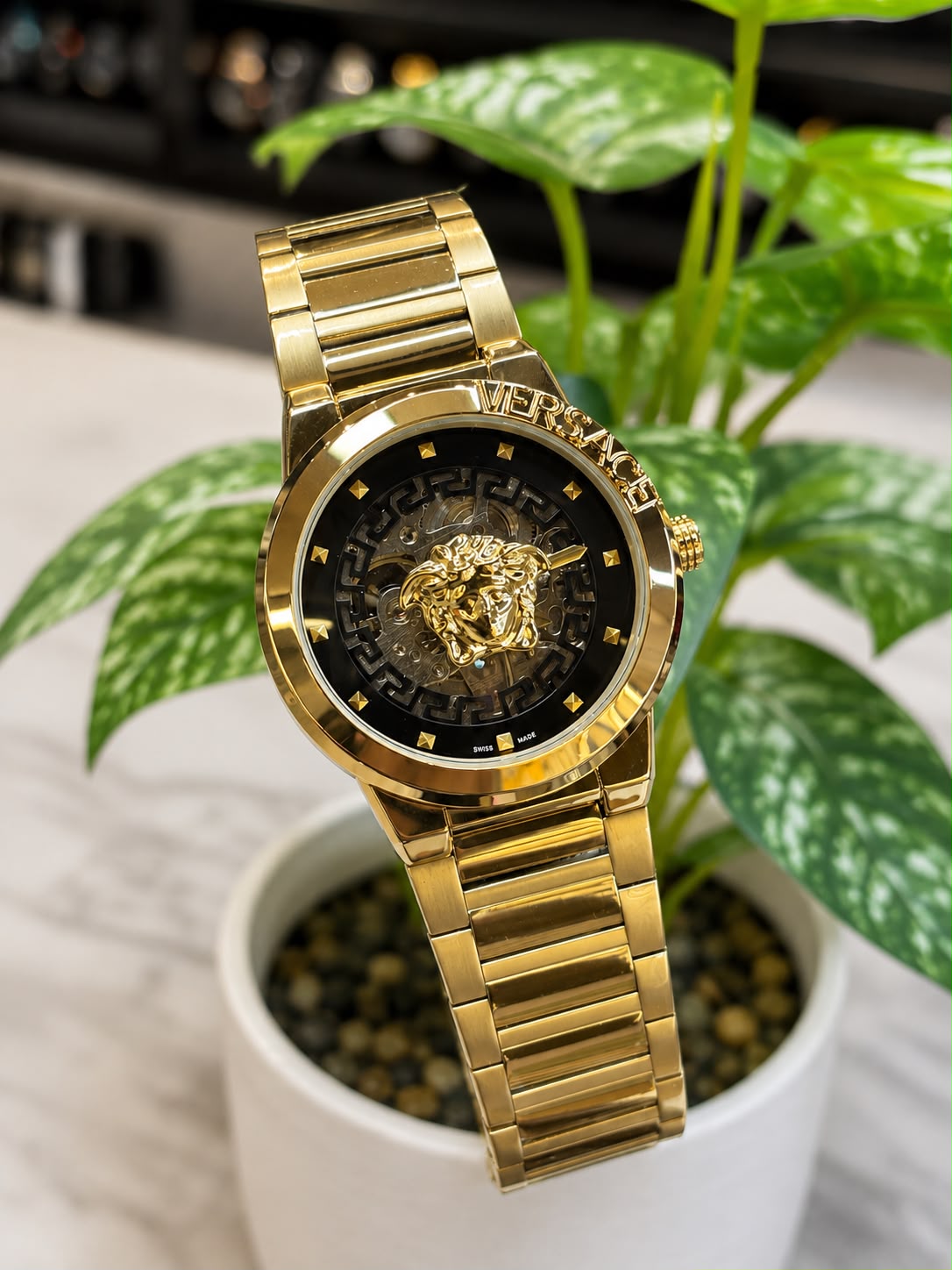Versace (logo and bezel engraving visible)