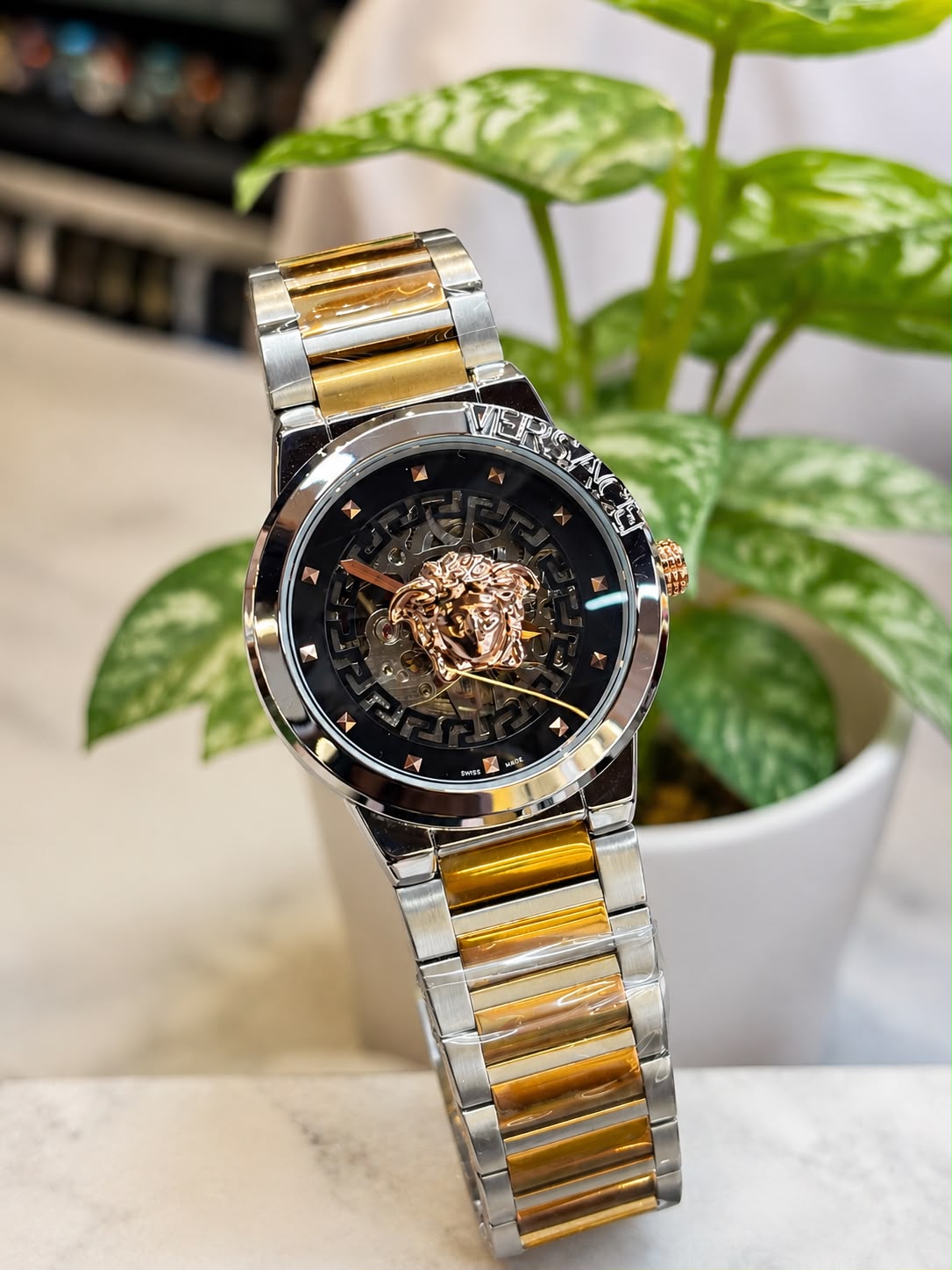 Versace (logo and bezel engraving visible)