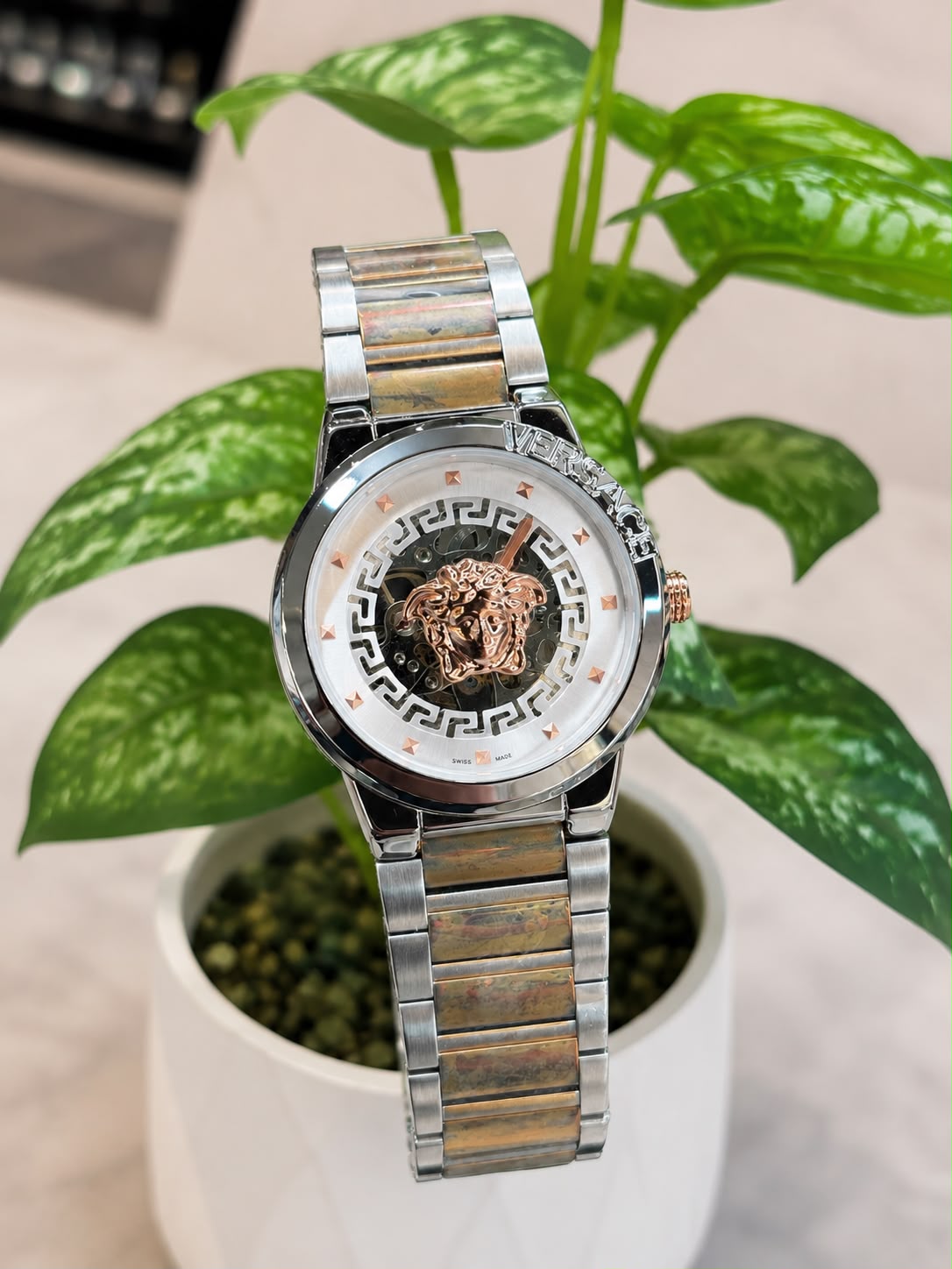 Versace (logo and bezel engraving visible)