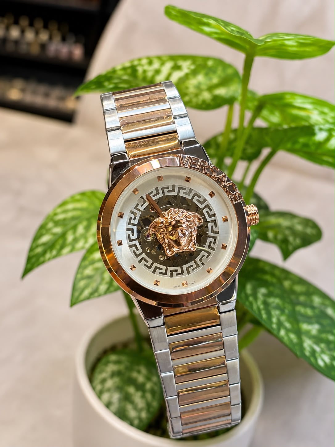 Versace (logo and bezel engraving visible)