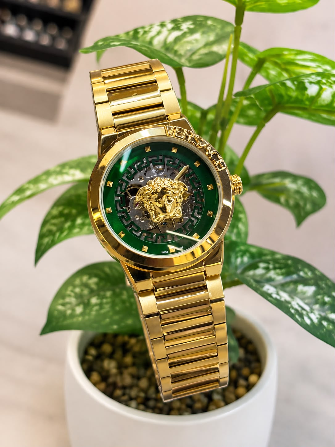 Versace (logo and bezel engraving visible)